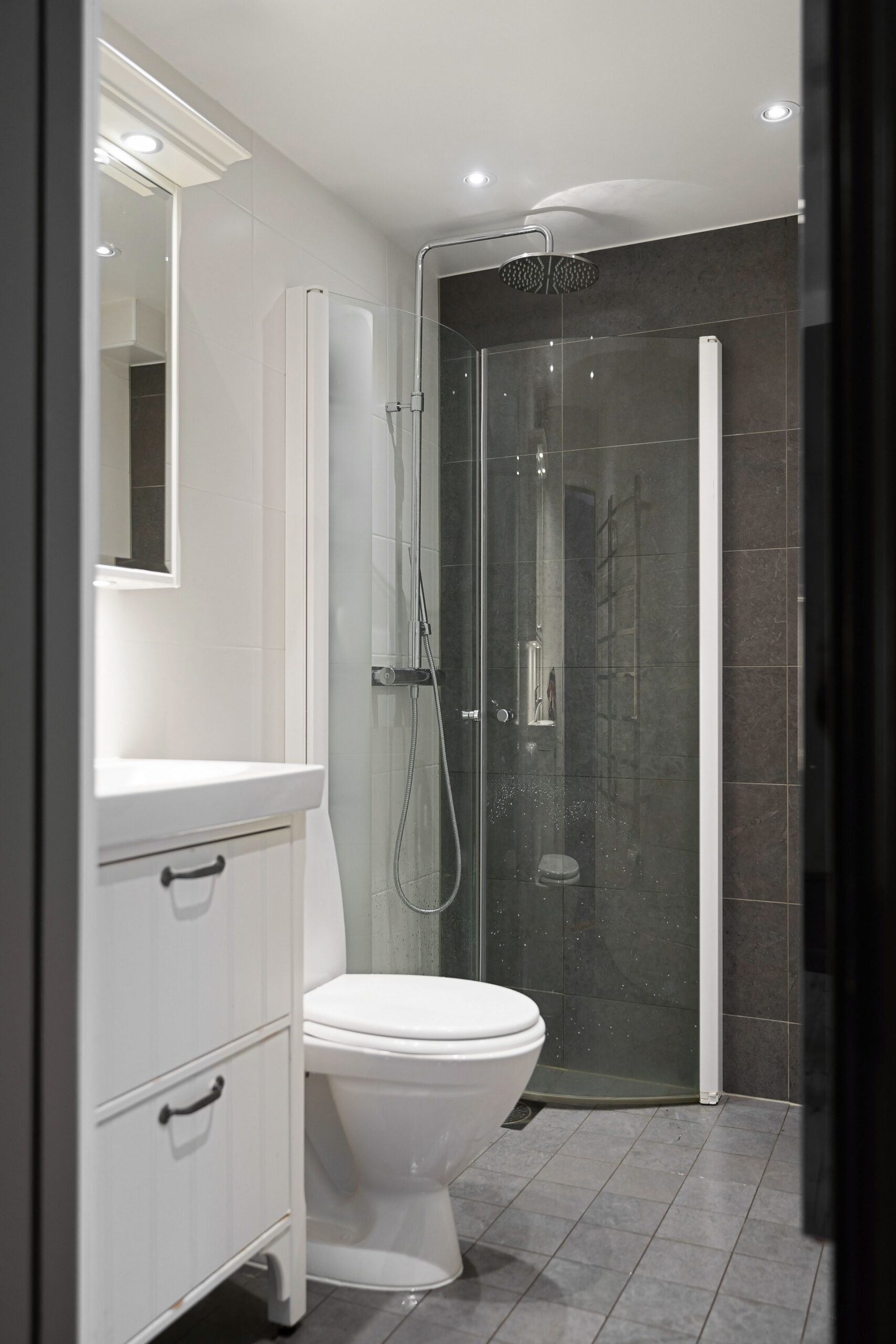 Small bathroom remodel with floating vanity and modern tile in a San Francisco condo