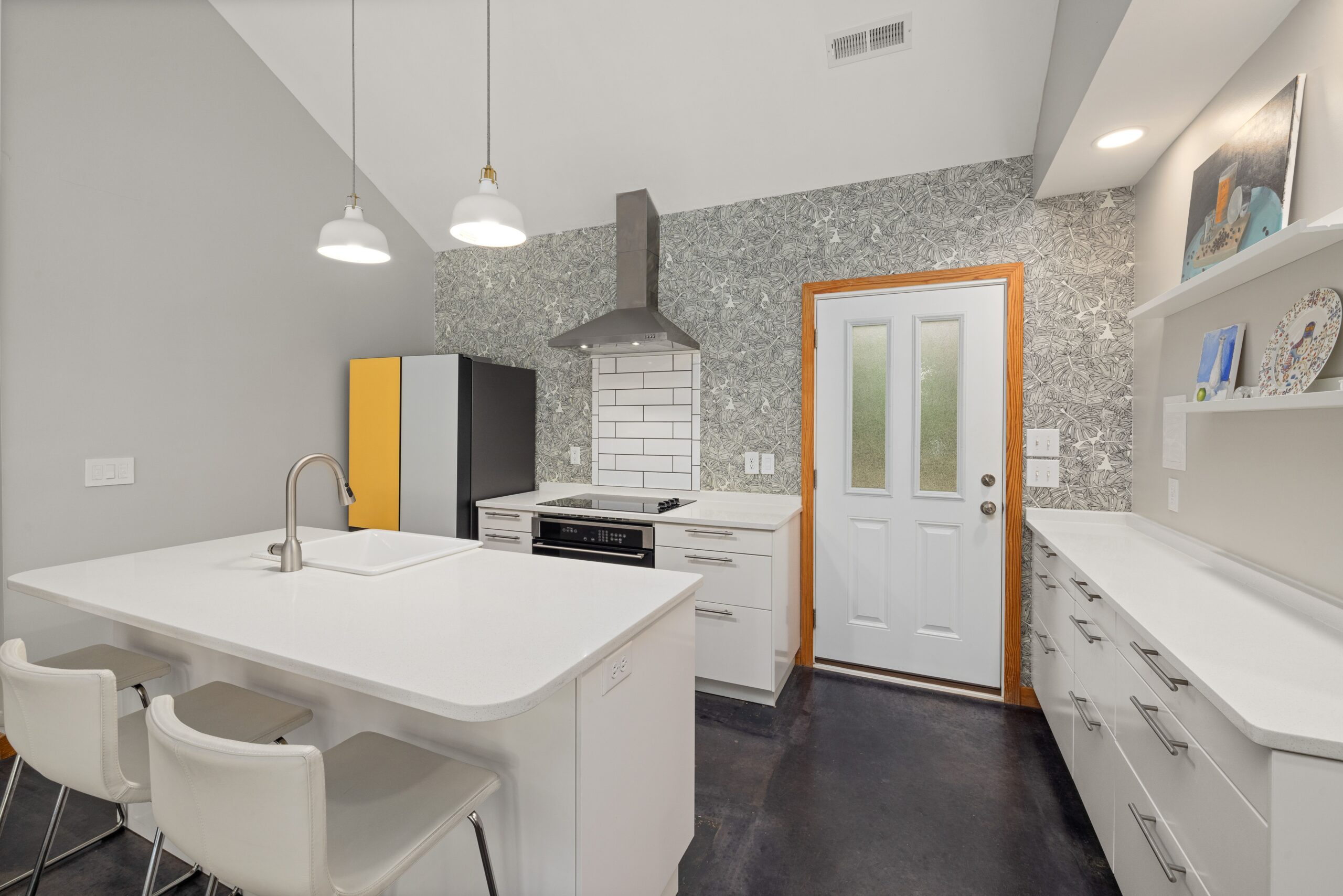 Modern kitchen remodel with white cabinetry and large island in a San Francisco home